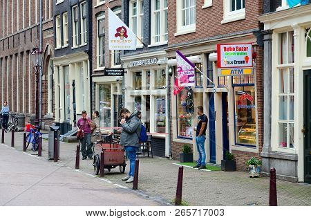 Amsterdam, Netherlands - September 6, 2018: Unidentified People Are Located Near Coffeeshop Rusland 