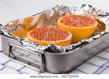 Halves Grapefruit In A Baking Dish. Fruits Baked In The Oven.