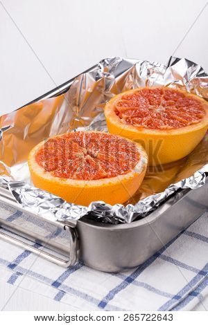 Halves Grapefruit In A Baking Dish. Fruits Baked In The Oven.