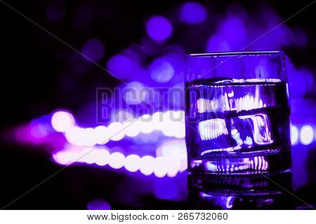 Colored Lighting Of Glasses In The Night Club Bar