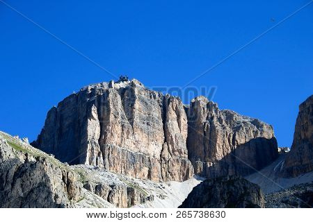 Sass Pordoi Mountain Massif With Cable Car Leading On Top With Blue Sky Background, Dolomites, Italy