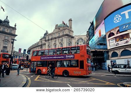 LONDON, UK - SEP 27: Piccadilly Circus street view on September 27, 2013 in London, UK. Built in 1819, it is the major shopping, entertainment areas and key tourist attractions in London.