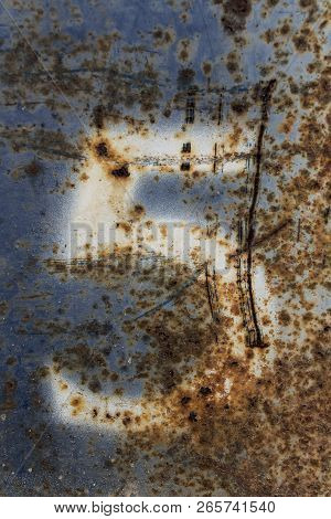 White Number Five Painted On Rusty Blue Metal
