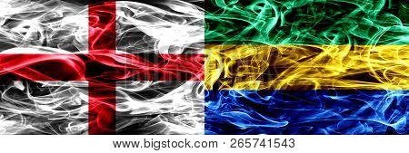 England Vs Gabon, Gabonese Smoke Flags Placed Side By Side. Thick Colored Silky Smoke Flags Of Engli