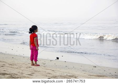 Little Girl, Standing Alone, Looking At Sea, Alibag Beach, India