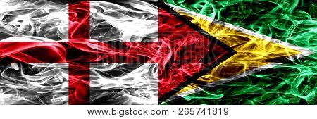England Vs Guyana, Guyanese Smoke Flags Placed Side By Side. Thick Colored Silky Smoke Flags Of Engl