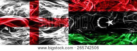 England Vs Libya, Libyan Smoke Flags Placed Side By Side. Thick Colored Silky Smoke Flags Of English