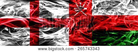 England Vs Oman, Omani Smoke Flags Placed Side By Side. Thick Colored Silky Smoke Flags Of English A