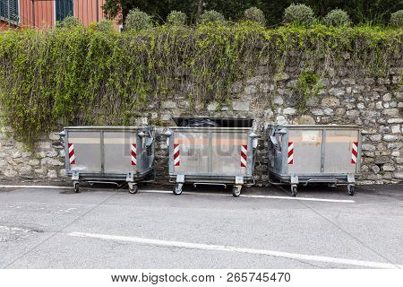 Dump Garbage Bin On Street  Near Concret Wall For Waste In Europe