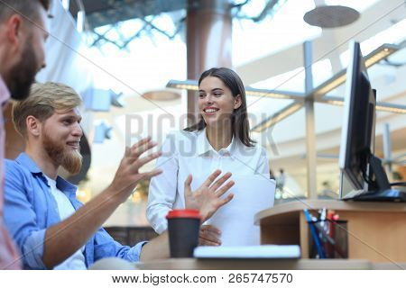 Group Of Young Modern People In Smart Casual Wear Having A Brainstorm Meeting While Standing In The 
