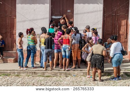 Trinidad, Cuba - Feb 8, 2016: Local People Wait In One Of Many Cuban Queues. Trinidad, Cuba.