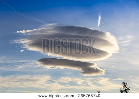 Large Circular Cloud Forms (altocumulus Lenticularis Duplicatus V-39) In The Evening Sky Over Malaga