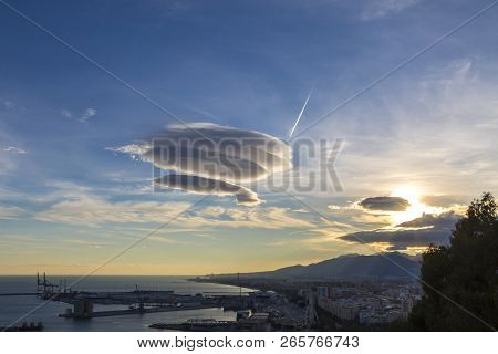 Large Circular Cloud Forms (altocumulus Lenticularis Duplicatus V-39) In The Evening Sky Over Malaga