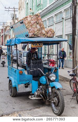 Cienfuegos, Cuba - February 11, 2016: Sofa Carrying Moto Taxi In Cienfuegos, Cuba.
