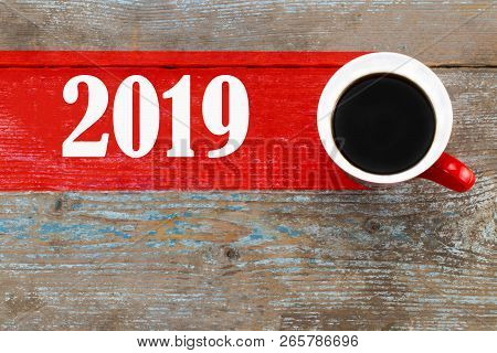 Mentoring / Cup Of Coffee With Mentoring Inscription On Wooden Background.