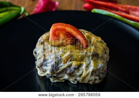 Turkish Bohca Kebab / Crepe With Cubed Meatball And Vegetables.