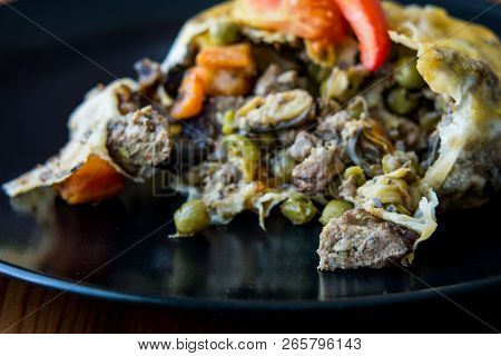 Turkish Bohca Kebab / Crepe With Cubed Meatball And Vegetables.