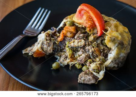 Turkish Bohca Kebab / Crepe With Cubed Meatball And Vegetables.