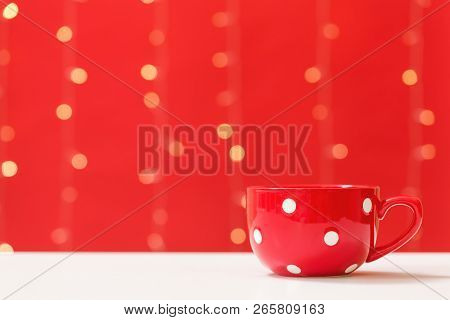 Cup Of Coffee On A Shiny Light Red Background