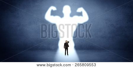 Businessman standing and dreaming about a strong superhero