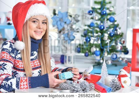 Portrait Of A Smiling Woman Preparing For Christmas