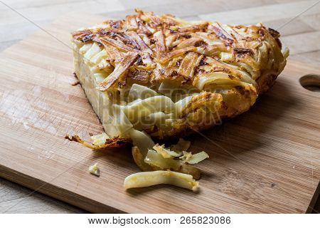 Turkish Food  Makarna Boregi / Macaroni Timbale On A Wooden Surface.