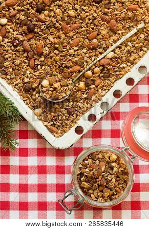 Homemade Granola On A Baking Sheet In Festive Decoration. Rustic Style.