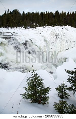 frozen waterfall Tannforsen in winter, Sweden