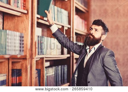 Vintage Style And Fashion. Bearded Man In Expensive Suit In His Cabinet. Professor Stands In Big Lib