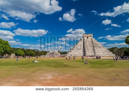 Chichen Itza, Mexico - Feb 26, 2016: Crowds Of Tourists Visit The Kukulkan Pyramid At The Archeologi