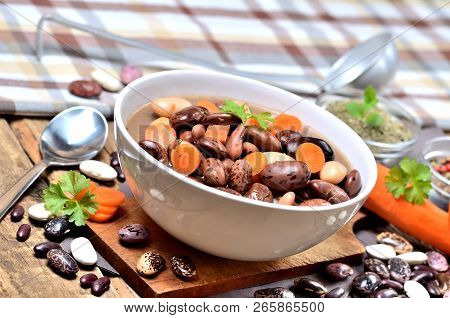Bean Soup With Large Beans, Carrots, Parsley, Marjoram, Spoon And Ladle