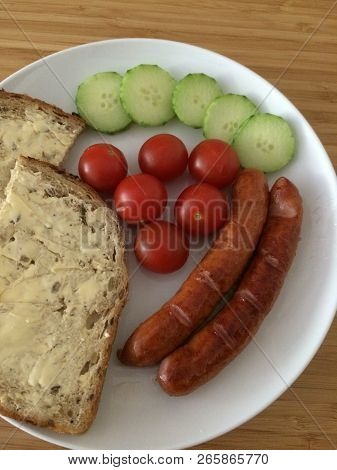 Smoked,tasty Sausages With Sandwich Served With Tomatoes