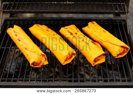 Meat On Grill For Shawarma. Yellow Pita Bread.