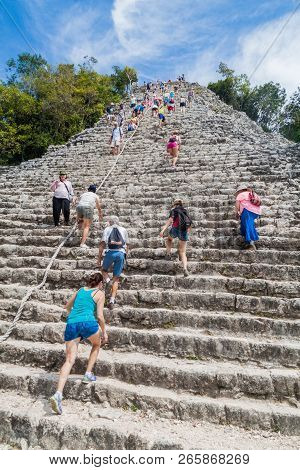 Coba, Mexico - March 1, 2016: Tourist Climb The Pyramid Nohoch Mul At The Ruins Of The Mayan City Co