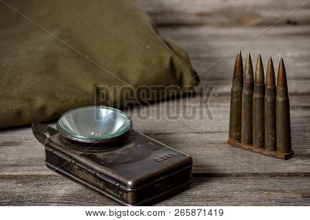 7, 92 X 57 - Rustic Ammos, Poncho And Old Flashlight Lies On The Wooden Background