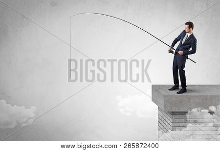Businessman fishing nothing from the cloud with free copyspace