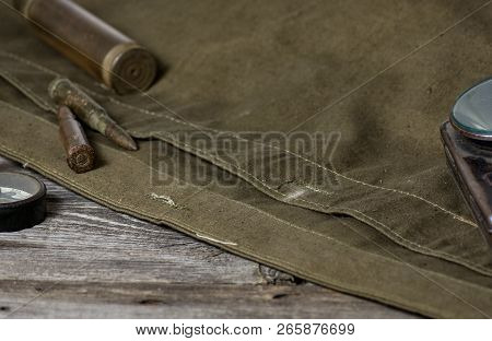 7, 92 X 57 - Rustic Ammos, Poncho And Old Flashlight Lies On The Wooden Background