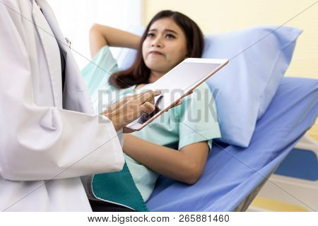 Patient fell worry when Asian Doctor make routine health check in hospital ward