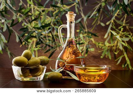 Tradition Crete Flavored Olive Oil With Spieces Rosemary And Pepper In Local Vial With Olives, And O