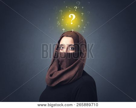 Young muslim woman wearing niqab with yellow question marks above her head