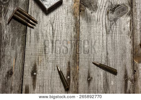Disassembled Clip With Cartridges 7, 92 X 57 - Rustic Ammos Lies On The Wooden Background