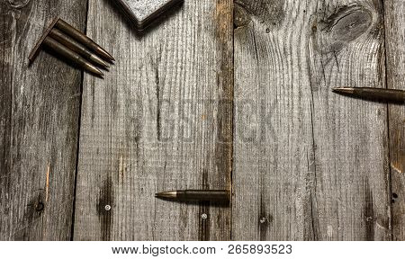 Disassembled Clip With Cartridges 7, 92 X 57 - Rustic Ammos Lies On The Wooden Background
