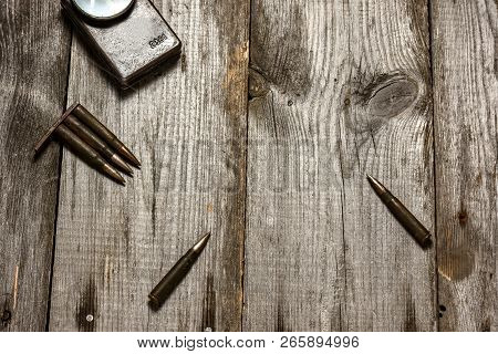 Disassembled Clip With Cartridges 7, 92 X 57 - Rustic Ammos Lies On The Wooden Background
