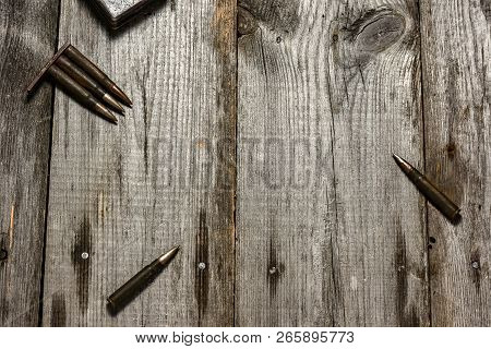 Disassembled Clip With Cartridges 7, 92 X 57 - Rustic Ammos Lies On The Wooden Background