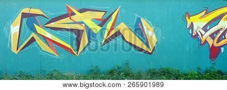 Full And Acomplished Graffiti Artwork. The Old Wall Decorated With Paint Stains In The Style Of Stre