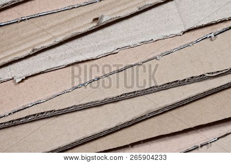 Background Of Paper Textures Piled Ready To Recycle. A Pack Of Old Office Cardboard For Recycling Of