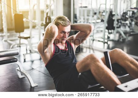 Storng Man Doing Situp Or Crunches In Gym,men Exercise Muscular Her Stomach