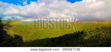 Landscape Of Mavrovo National Park With Rainbow, Mountain And Lake In Fyr Macedonia