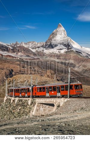 Famous Matterhorn Peak With Gornergrat Train In Zermatt Area, Switzerland