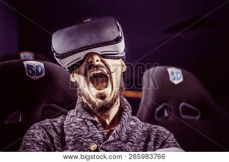 Man In Virtual Glasses Is Watching A Movie In 5D In A Cinema